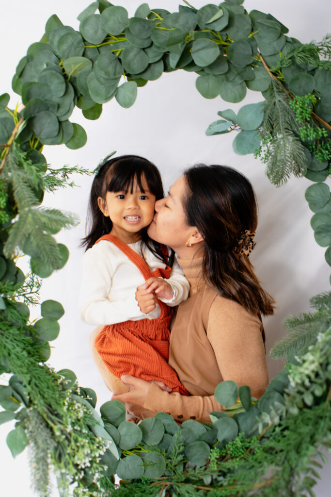 Mom and daughter posing for Christmas photos in Roseburg OR