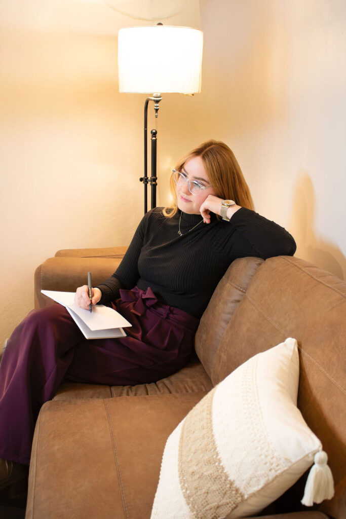 Entrepreneur branding headshot in Roseburg Oregon showing a therapist seated beside a guitar at Studio Thirteen.
